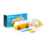 Toy Volkswagen Beach Bus with its blue packaging box, surfboard accessory, and sticker pack.