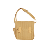 Honey-colored quilted convertible diaper changing bag with adjustable shoulder strap.