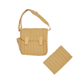 Honey-colored quilted convertible diaper bag with matching changing mat on a white background.