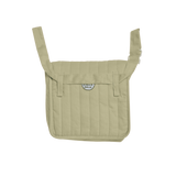 Sage green Dinkum Dolls convertible changing bag with quilted vertical stripes and adjustable strap.