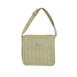 Sage green quilted Dinkum Dolls Carrie convertible changing bag with shoulder strap.