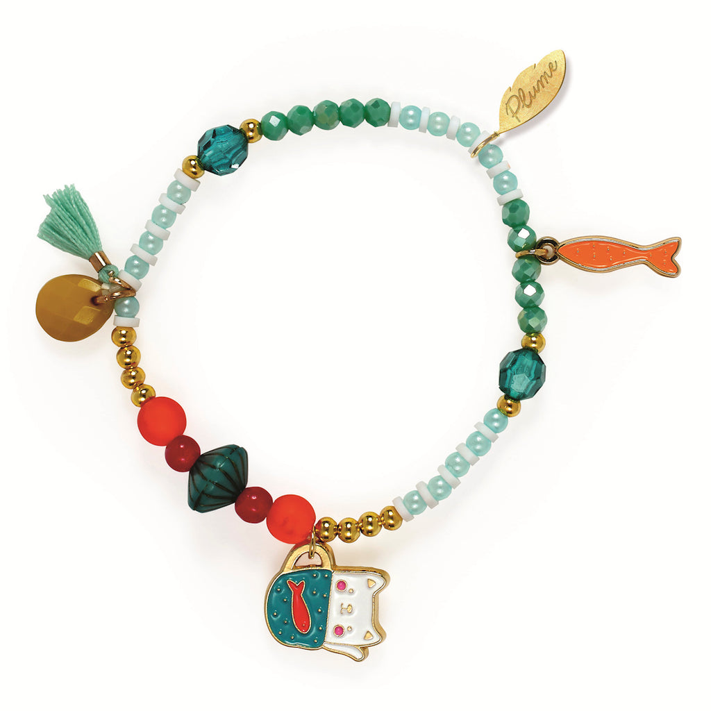 Colorful bracelet with beads in turquoise, red, and gold hues, featuring charms of a fish, a cat, and a tassel. Vibrant and playful design.