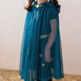 Child wearing a teal blue glittery hooded cape with a gold star clasp for dress-up play.