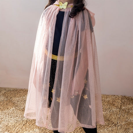 Child wearing a light pink glitter dress-up cape with a gold butterfly clasp and tulle mesh fabric.