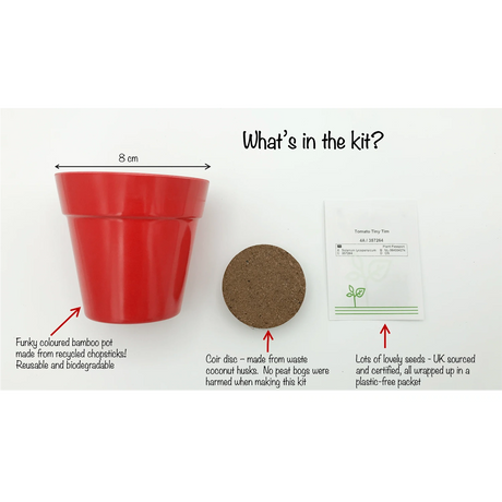 Cherry tomato growing kit with a red bamboo pot, a soil coir disc, and a packet of seeds.