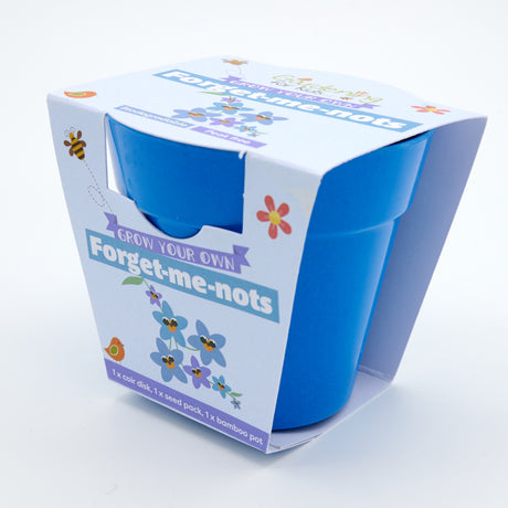 Blue bamboo plant pot in light blue packaging for a children's "Grow Your Own Forget-me-nots" kit.