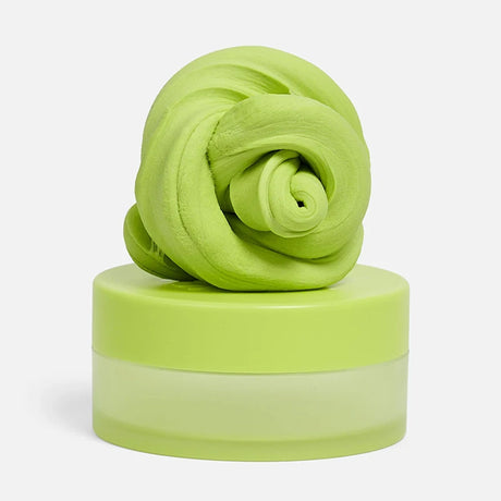 Swirled light-green focus putty resting on top of its matching circular container.