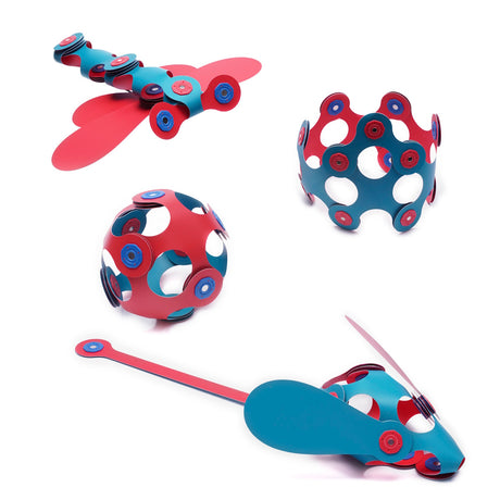 Pink and turquoise magnetic toy creations, including a butterfly, ball, crown, and mouse, on a white background.