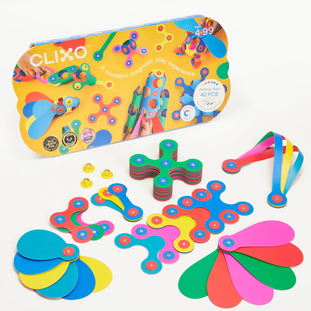 Colorful magnetic toy set with various shapes and bright hues of red, blue, yellow, and green on a white background. Packaging shows playful assembly.