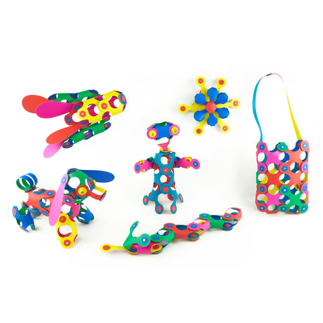 Various colorful creations, including a dog, bag, and figure, made with flexible magnetic toy pieces.