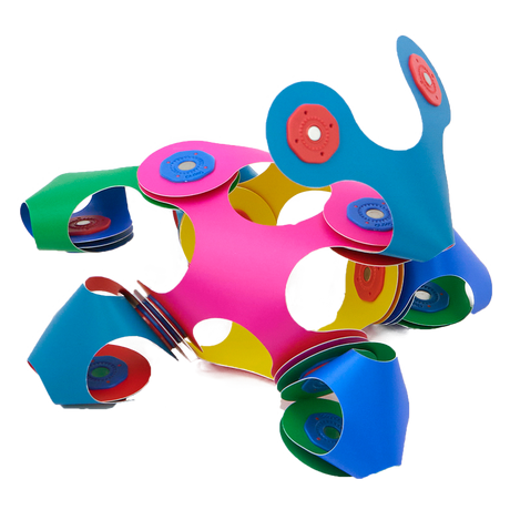 Colorful, flexible magnetic toy pieces connected into a 3D structure on a black background.
