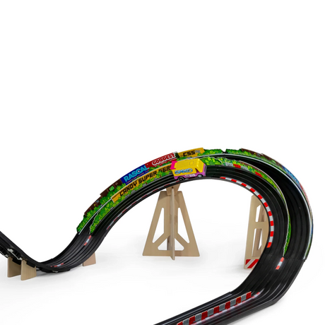 Close-up of a toy car on a Candylab Roadworks banked turn track with wooden supports and colorful racing graphics.
