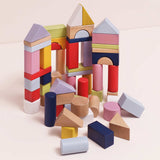 Colorful wooden building blocks stacked into various structures and towers.