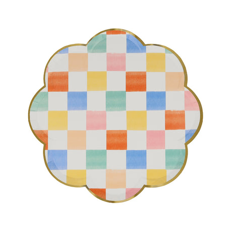 Scalloped side plate with a gold rim and colorful checkered pattern.