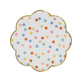 Scalloped side plate with a gold rim and multicolored polka dot pattern.