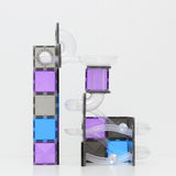 Glittery purple, blue, and black magnetic tile ball run structure with clear tracks and silver balls.