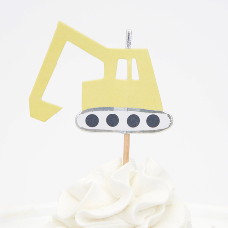 Yellow excavator cupcake topper on a wooden pick in swirled white frosting.