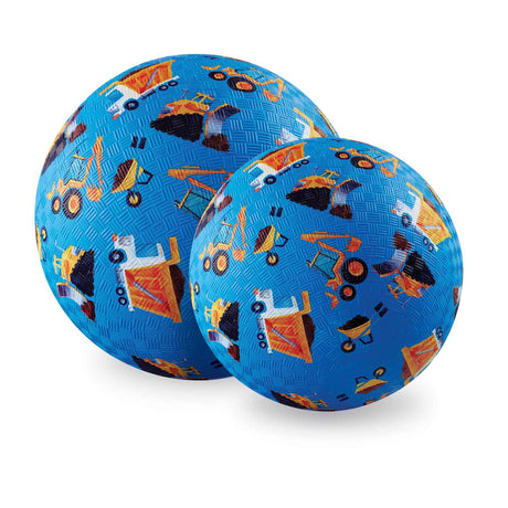 Two blue textured playground balls featuring a colorful construction vehicle pattern on a white background.