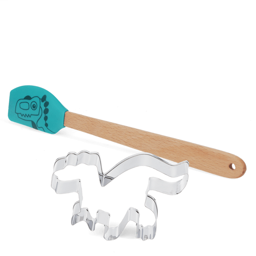 A playful baking set featuring a turquoise spatula with a dinosaur illustration on a wooden handle, alongside a metal dinosaur-shaped cookie cutter.