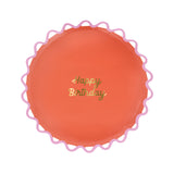 Meri Meri coral Happy Birthday paper plate with a pink wiggle scalloped edge and gold foil script.
