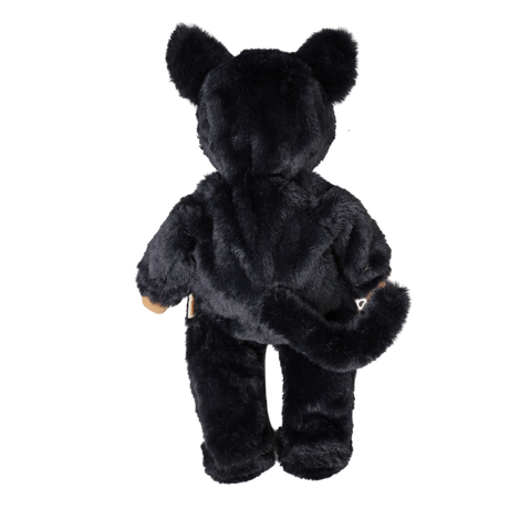 Back view of a plush doll in a fuzzy black cat suit with cat ears and a long tail.