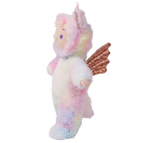 Side view of Cozy Dinkum Sunbeam doll in a pastel rainbow unicorn plush outfit on a white background.