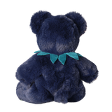 Back view of Olli Ella Cozy Dinkum Blueberry Bear plush toy against a white background.