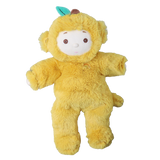 Front view of Olli Ella Cozy Dinkum Mango Monkey yellow plush doll against a white background.