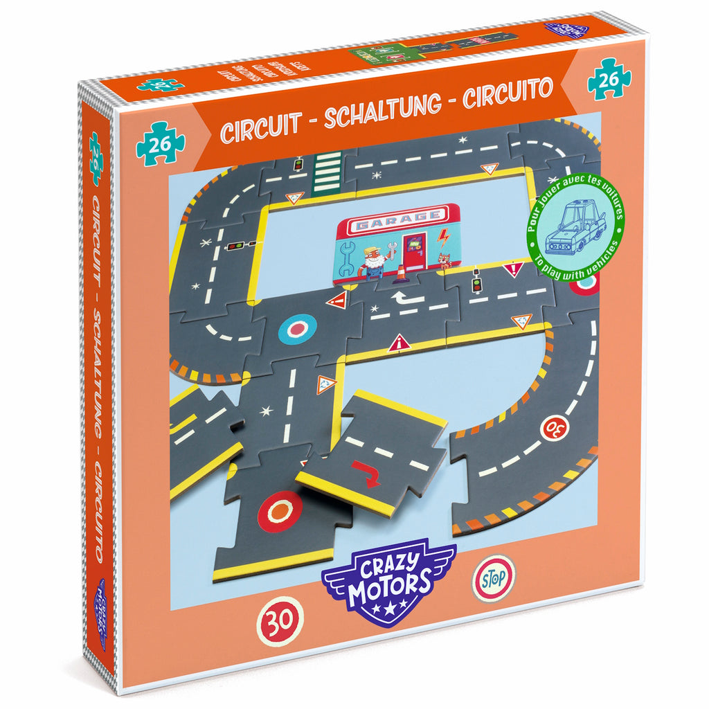 Puzzle box for a toy road circuit set. The box is orange, featuring a road layout graphic with colorful traffic signs and a garage illustration.