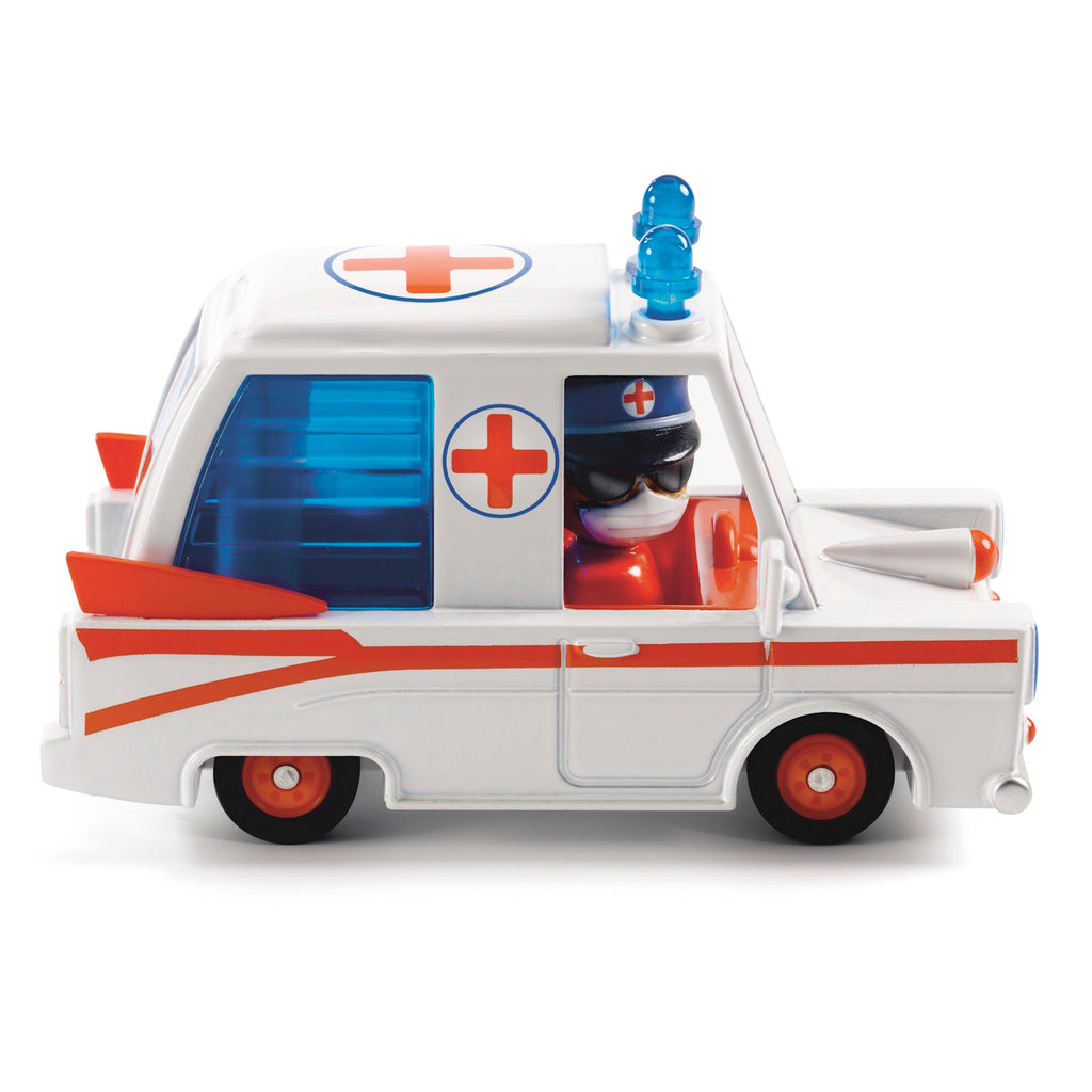 The ambulance is crafted from metal with a distinctive, colorful design. It includes a pilot character whose head can rotate, adding to the interactive play experience.