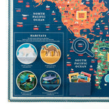 Interactive world map display showing animal habitats, 3D pop-up biome circles, and a paper magnifying glass.
