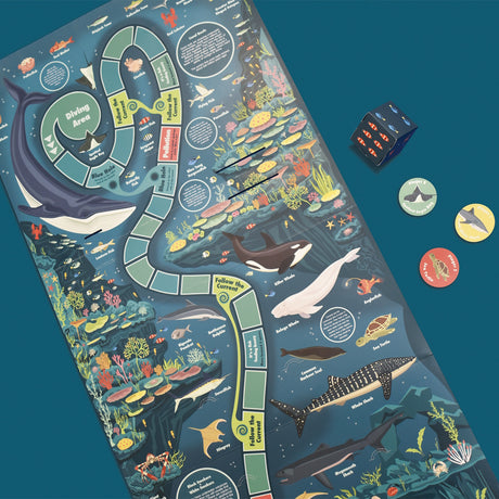Ocean-themed board game mat featuring sea creatures, a winding game path, die, and player tokens.