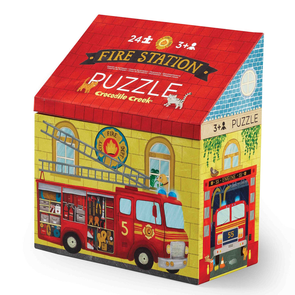 Brightly colored fire station puzzle box shaped like a two-story building with a fire truck graphic, ladder detail, and playful illustrations.