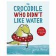 Book cover of The Crocodile Who Didn't Like Water by Gemma Merino, featuring a green crocodile with a red swim ring.