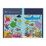 Cartoon-style ocean scene in a notebook with colorful sea creatures: shark, fish, turtle, jellyfish, octopus, and coral. Playful and vibrant.