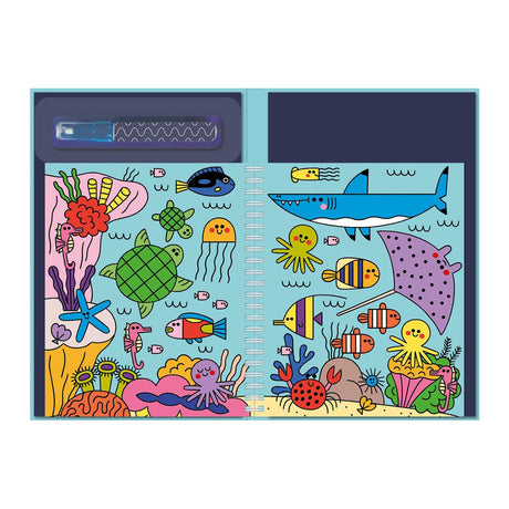 Cartoon-style ocean scene in a notebook with colorful sea creatures: shark, fish, turtle, jellyfish, octopus, and coral. Playful and vibrant.