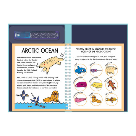 Spiral-bound book open to Arctic Ocean-themed pages. Left page has a polar bear illustration and text about the Arctic. Right page features circles with cartoon animals like orca and narwhal, above a marker pen. The tone is educational and playful.