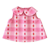 Pink plaid doll dress with strawberry print and peter pan collar.