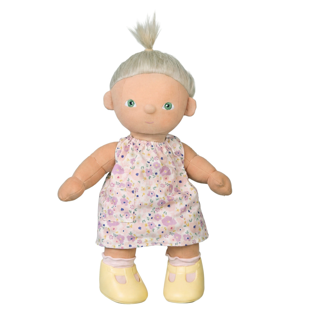 Dinkum Doll with blonde hair wearing a pink floral Suki dress and yellow shoes.