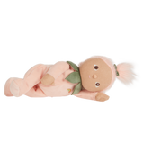 Olli Ella Dinky Dinkums Peggy Peach plush baby doll lying down.