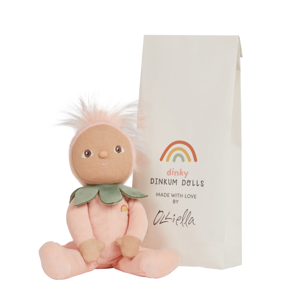 Olli Ella Dinky Dinkums Peggy Peach doll sitting next to its paper bag packaging.