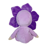 Back view of a plush violet flower doll in a light purple body suit on a white background.