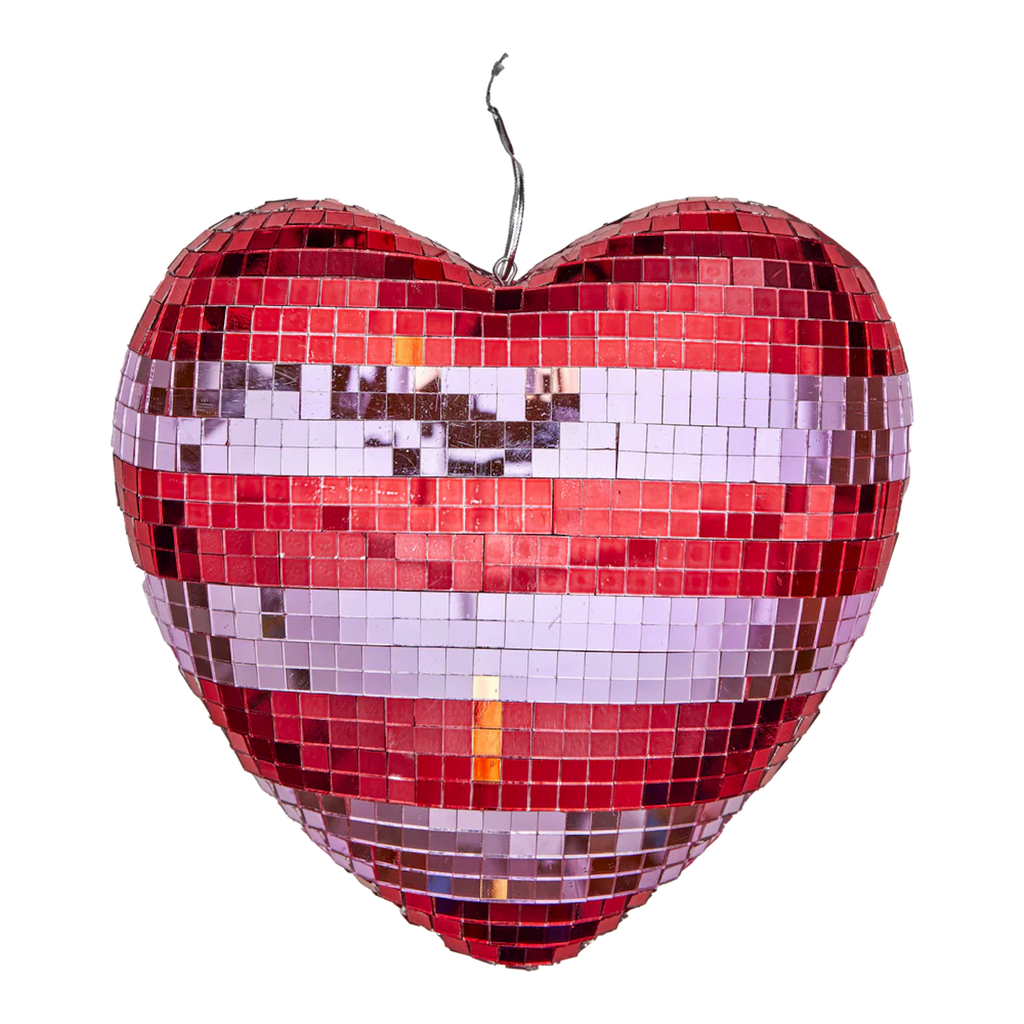 A heart-shaped mosaic disco ball with red, white, and silver tiles, creating a reflective and festive appearance against a white background.