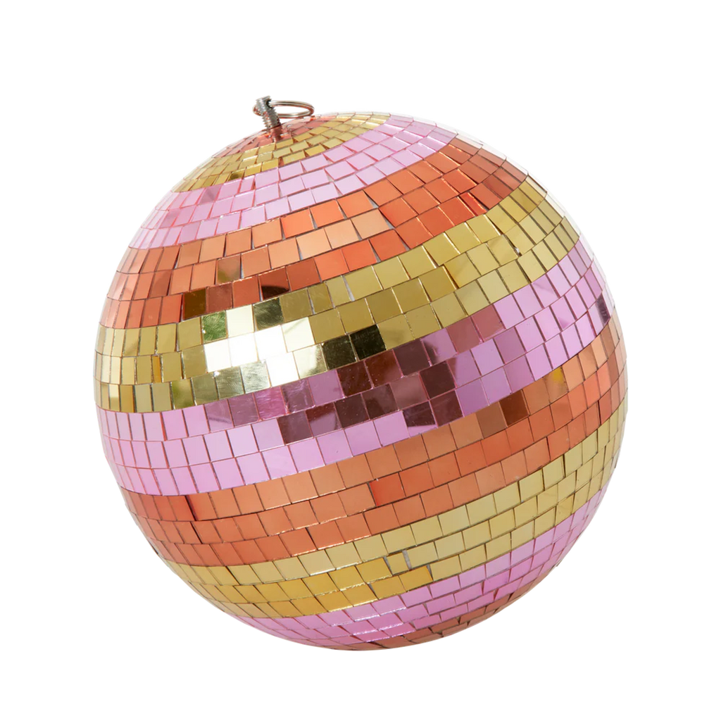 A spherical disco ball with shimmering tiles in pink, orange, and gold stripes against a white background, creating a festive and vibrant tone.