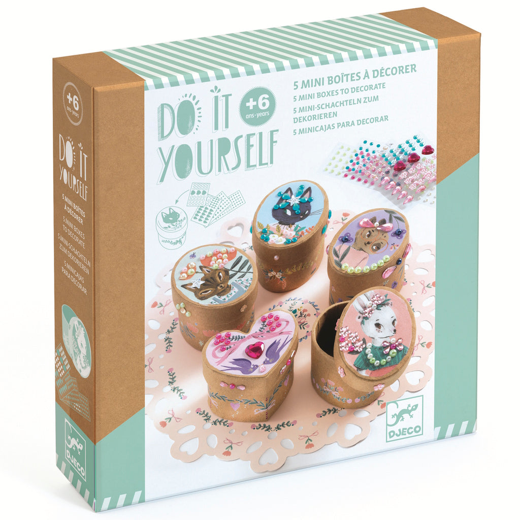 A craft kit with small, decorative boxes for kids to assemble and embellish with stickers, patterns, and colourful designs.