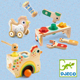 Colorful Djeco wooden toddler toys including a chicken pound-a-ball, shape sorter, and rolling hen on blue.