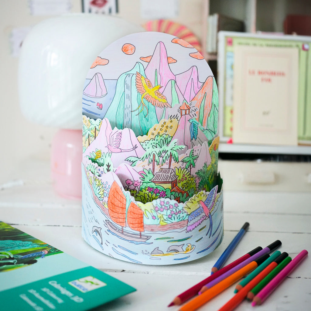 Showcasing a detailed, imaginative island scene with animals, nature, and playful elements for children to colour.