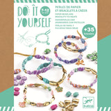 DIY bracelet kit packaging for ages 7-12, displaying colorful paper bead bracelets with gold accents and charms. The tone is creative and playful.