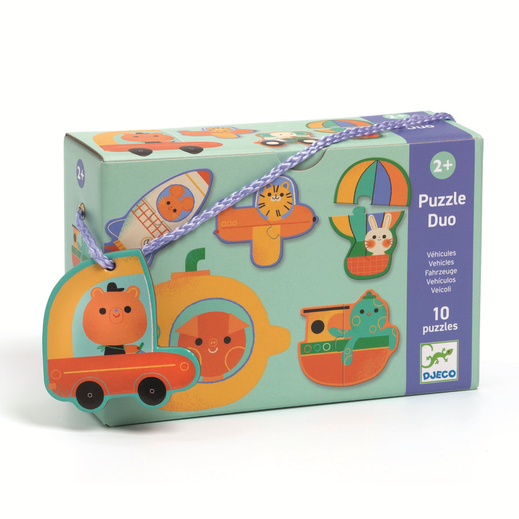 Colorful "Puzzle Duo" box for ages 2+, featuring illustrated vehicles with animals. Box is turquoise with playful, vibrant designs.