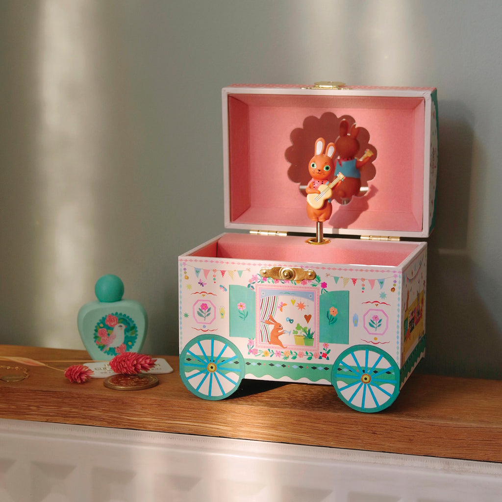 Inside, the box is lined with soft velvet and includes a spacious compartment for storing jewelry and small treasures.